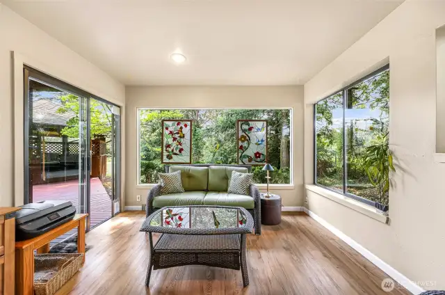 Sunroom/office/guest bedroom has an outdoor entrance to the back patio and gazebo.