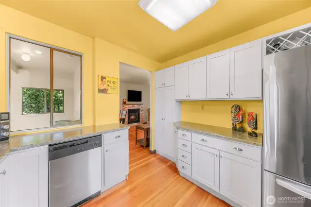 Kitchen towards the window into the sunroom and into the living room.