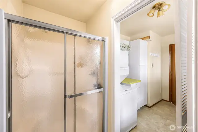Shower in the entry off of the carport.