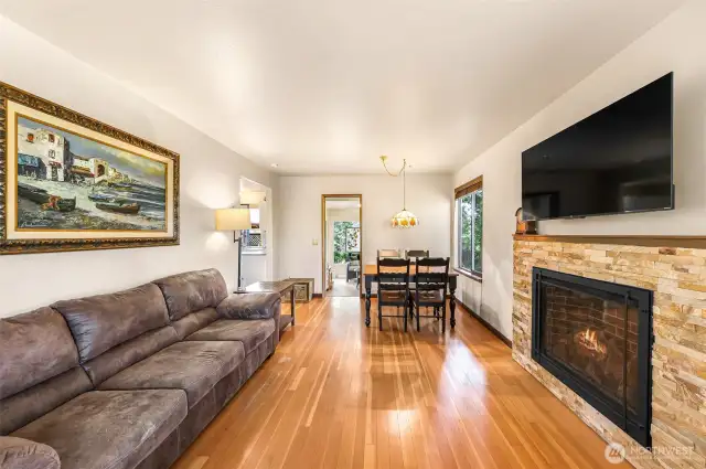 Natural gas fireplace heats the home and has attractive rock surrounding.