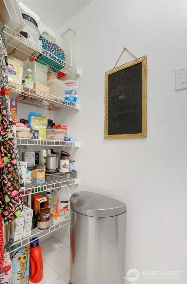 There is additional pantry space across from the washer/dryer adjacent to the kitchen.