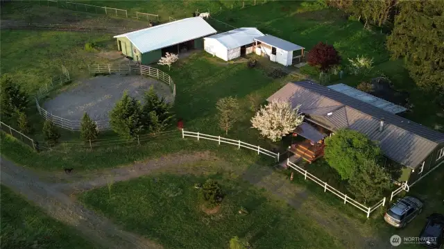 3 bed 2 bath 1848 sq ft home, round pen, 24x48 horse barn, smaller white barn can accommodate 4 10x10s or 2 10x30 stalls and small 2 stall shed.