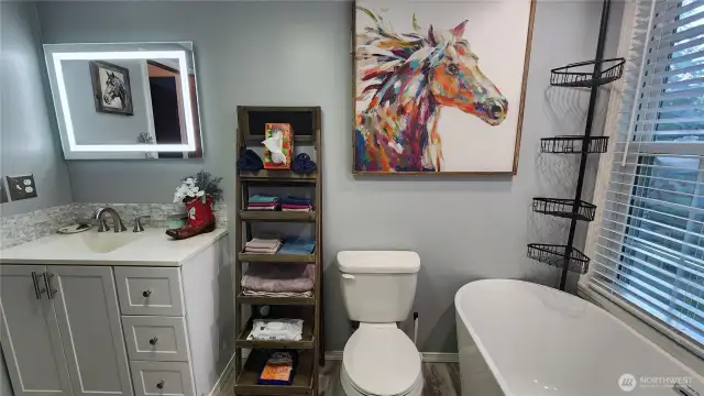 The second full bathroom serves the two bedrooms located at the opposite end of the home.