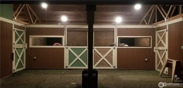 Stalls are matted and in good condition. Marina board from floor to 4 feet. 12x12 stall grids off each stall for mud control. Stall grids between each stall so the horses can see each other. 12x24 hay storage with man door on the interior side and large slider door on the exterior.