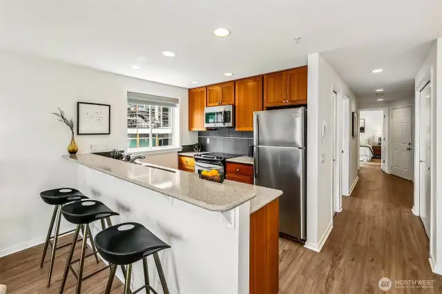 Bar seating! Kitchen has plenty of counter space great storage, and a window.