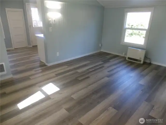 Living room into kitchen from the front door.