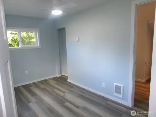 One of the two bedrooms.  This one has the bathroom attached at one door and the other door leads out to the living room.