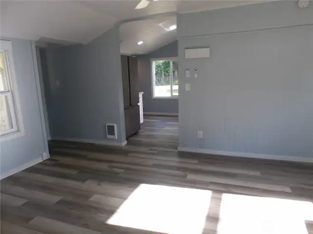 Exit west side bedroom into living room and go into other bedroom or the kitchen.
