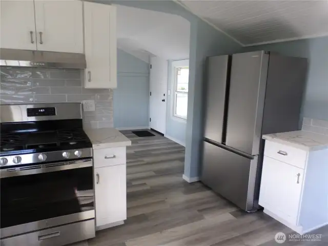 Backdoor entry to the house takes you into the new kitchen.