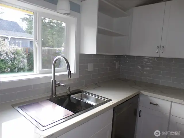 The fresh and new look of this remodeled kitchen makes for lovely surroundings.