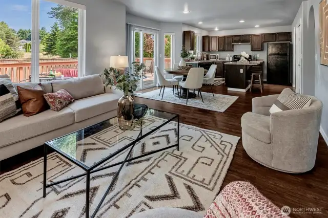 Expansive deck fits both outdoor dining & conversation area.