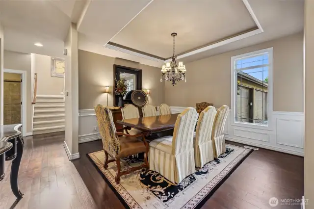 The formal dining room offers the perfect  setting for special gatherings, while to the  left of the front door, the formal living room  invites relaxation and conversation in a  sophisticated space.