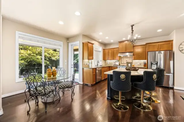 Gleaming hardwood floors really shine  throughout the entry, kitchen & formal dining  room.