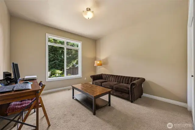 Main floor bedroom with closet tucked nicely behind the kitchen with 3/4 bath in hallway.