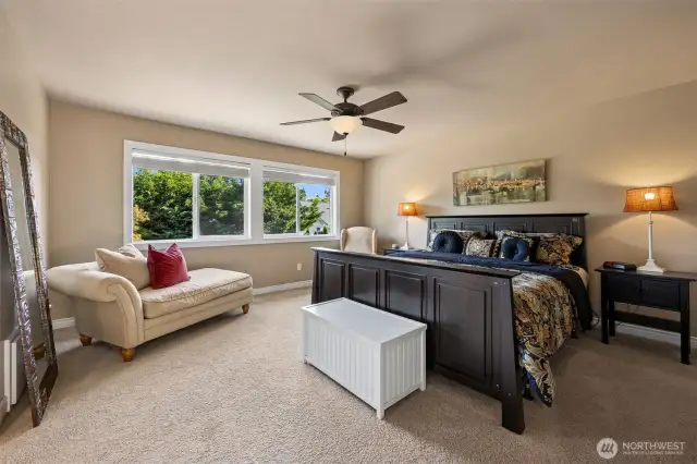 This primary suite is very large- big enough for king size bed, two nightstands, sitting chair plus a chaise lounge!