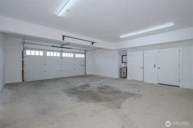 Finished 2 car garage with sink, elevator access, elevator maintenance room and large storage/mechanical room.