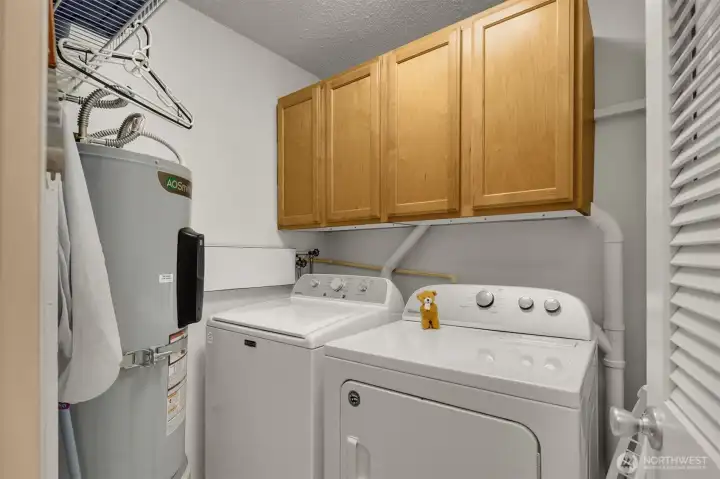 Large Laundry Room w/plenty of storage. W/D installed 2025. Hot water tank installed 2024.