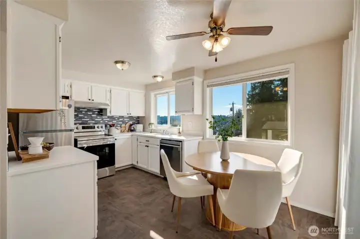 Eat in kitchen w/ ceiling fan for comfort.
