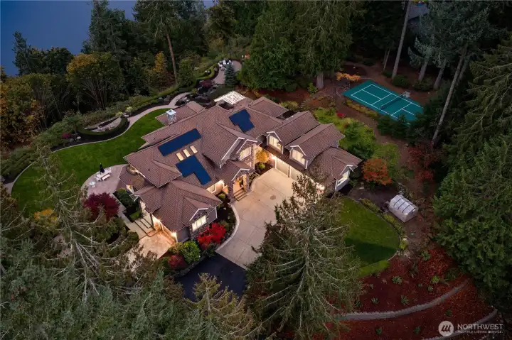 The shy seven acres includes a pickball court, multiple waterfalls, and several outdoor entertaining spaces.