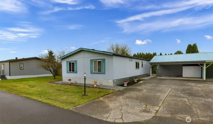 Move In Ready!  Best interior layout in the Mountain Vista Park.  Mountain Vista is a coveted All AGES park in Ferndale on the East side of Main St.  Plus, it's pup friendly! This park provides a nice spacious carport with barn door type slider to its storage area and a metal utility shed.  $575 covers your park maintenance (example - the night light seen in this picture & carport) yes, the carport is provided by Mountain Vista.
