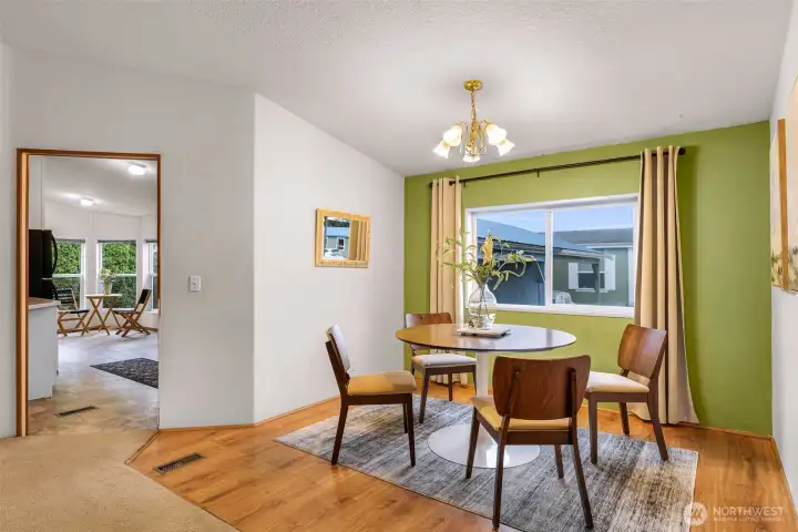 Off of the kitchen, you'll find the dining room area that looks over your carport and parking.  Nice and bright, receiving the West sunny daylight.