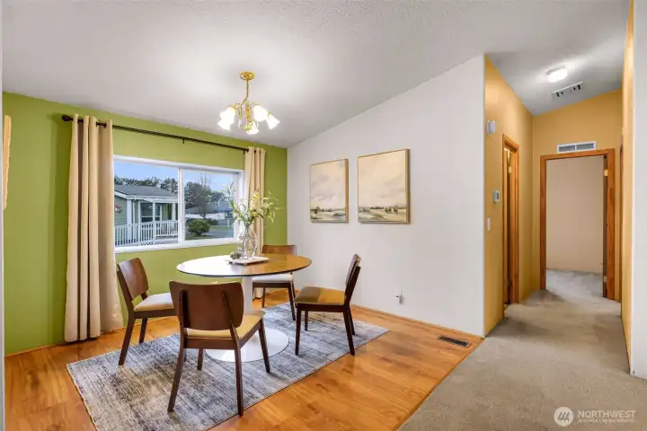 View from the dining area looks out towards the other park owners and the hallway to your right, has the full bathroom and 2 bedrooms on the North side of the home.