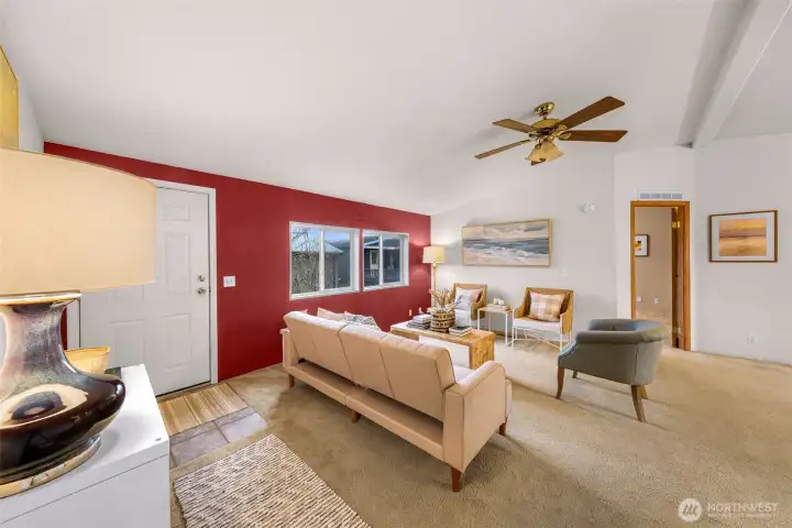 The door you see on your left, is the front porch to your entry area.  High ceilings and fan/light fixture.  The primary bedroom doorway is seen to your right.