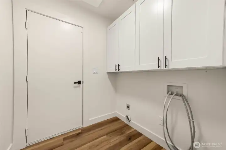 Entry from garage with laundry space and more storage