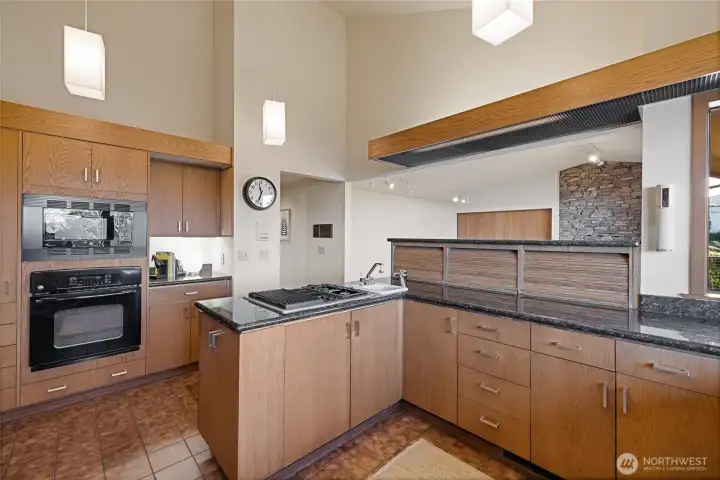 Kitchen with custom wood cabinets and granite