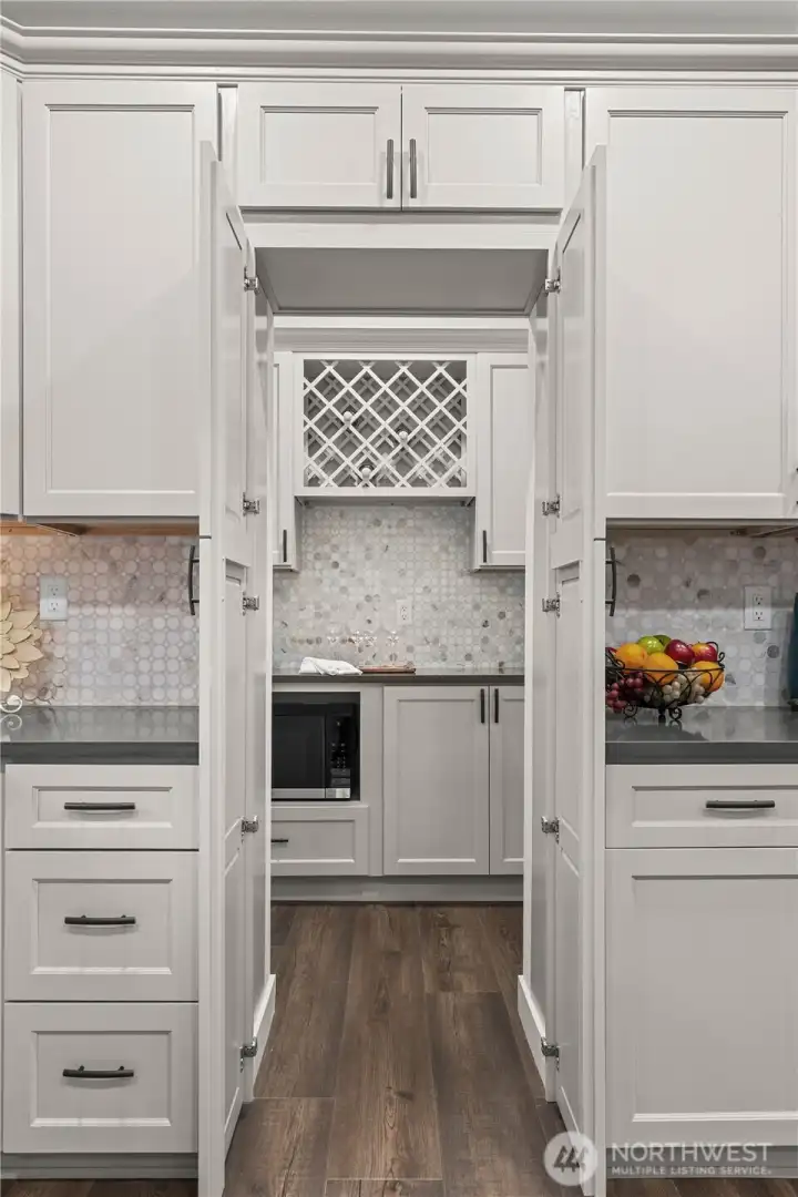 Surprise! This Cabinet opens to reveal a hidden Butler's Pantry.