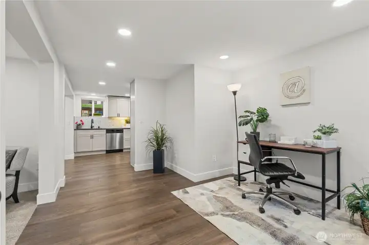 View upon Entry into this 2 Bedroom / 1 Bath Unit. Laminate Floors through the Entries, Kitchen and Bath