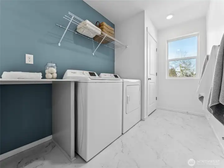 Laundry room upstairs with quartz countertop. Pictures are for representational purposes only, colors and features may vary.