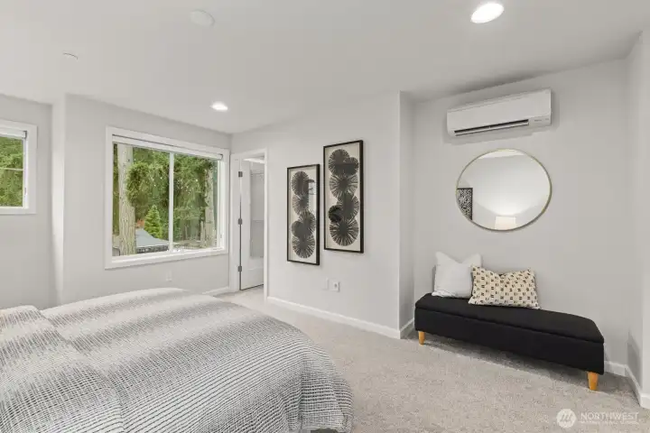 Primary bedroom with ensuite bathroom & walk-in closet (staged)