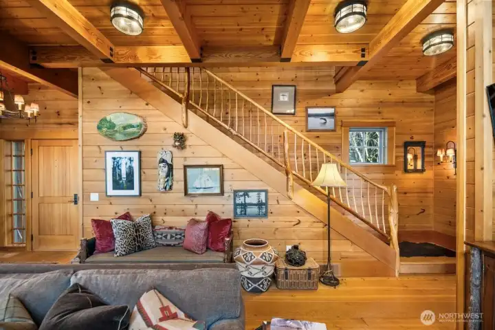 GORGEOUS T&G CEDAR PANELING AND SOLID DOUGLAS FIR CEILING BEAMS FRAME THE RUSTIC STAIRCASE