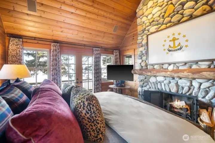 PRIMARY BEDROOM WITH FRENCH DOORS ACCESS TO PRIVATE BALCONY