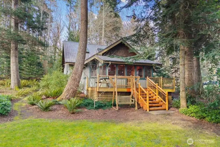 ENTRANCE TO THE SCREENED IN PORCH BUNKBEDS AND ADDITIONAL INTERIOR BUNKHOUSE ROOM