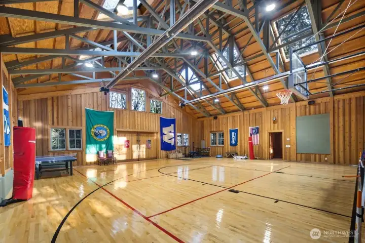 AWESOME SPACIOUS GYMNASIUM W/HUGE SKYLIGHTS ADDS TO THE BEAUTY OF THIS SPORT COURT WHICH HAS MULTIPLE USES FOR RECREATION. ALSO USED AS AN ART AND YOGA STUDIO AT TIMES