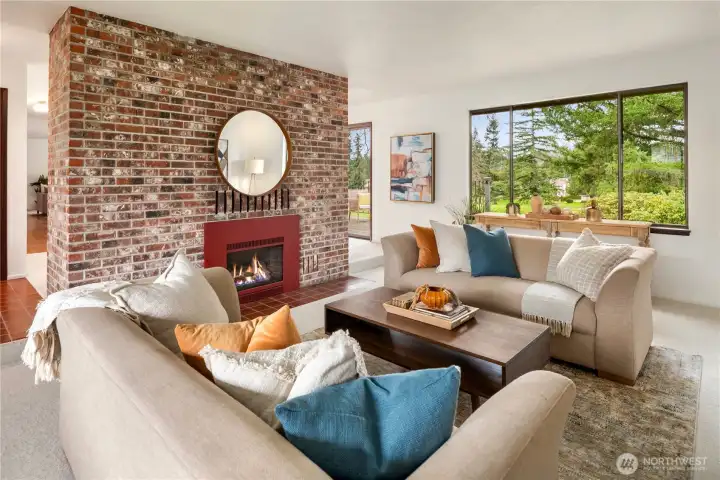 Sunken living room with gas fireplace and new carpet.
