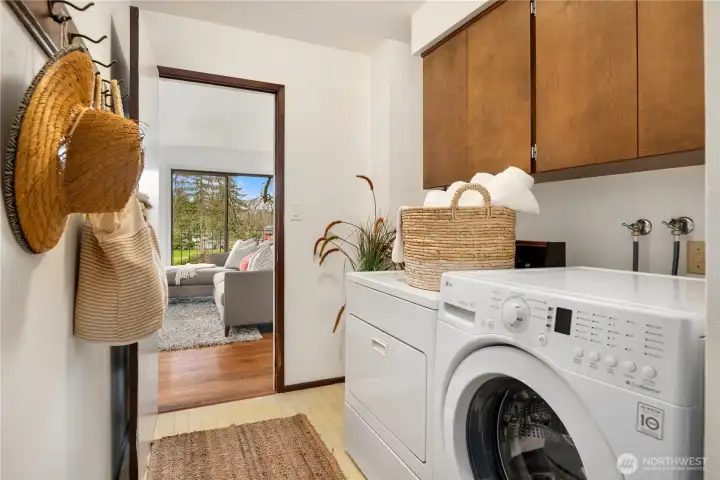 Laundry area tucked out of sight, just off the 2-car attached garage.