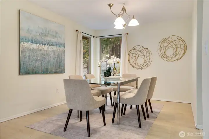 The living room flows seamlessly into the formal dining area, creating an ideal layout for both everyday living and entertaining