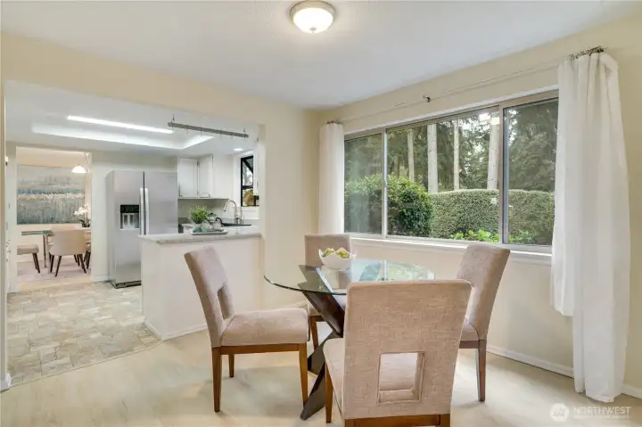 Off the kitchen, a bright eating area provides the perfect spot for casual dining and morning coffee