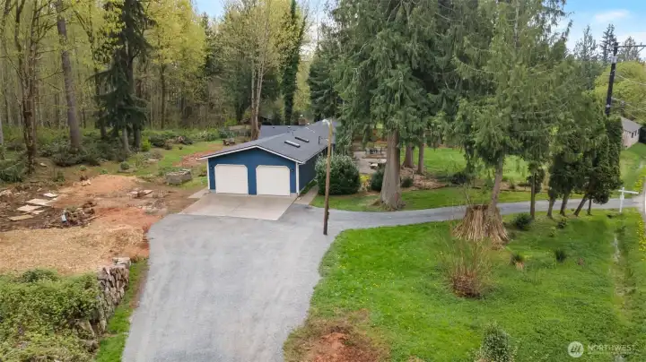 Oversized double car garage on forested and usable .83 acre