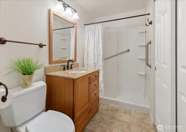 The attached bath adds convenience and privacy to the space.