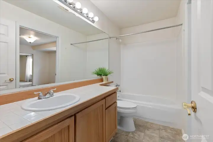 The bathroom is also accessible from the hallway, offering an ideal layout for both residents and visitors.