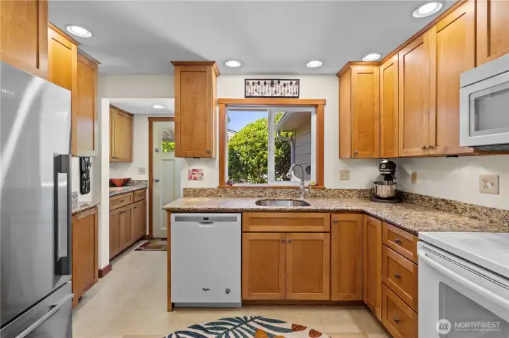 Kitchen with Newer White Appliances: Stove/Range, Microwave and Dishwasher (Fridge does not convey).
