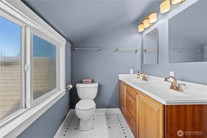 Upstairs: Updated Tile in the Bathroom with Original Charm intact!