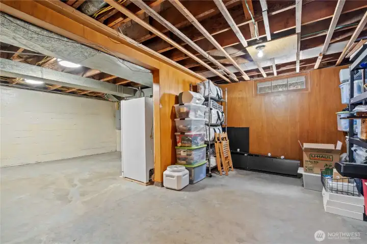 Partially Finished Room looking into the rest of the basement.