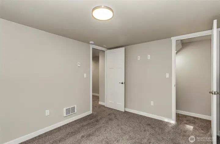 Downstairs bedroom #3 ~ new paint, new carpet, new lighting, heating~