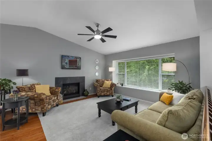 Gather and relax in the inviting living room featuring a warm propane fireplace Gather and relax in the inviting living room featuring a warm propane fireplace