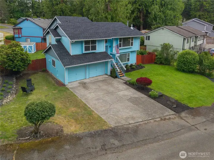 Bird's-eye perspective showcases exceptional curb appeal, generous outdoor space, and the home's attractive split-level design Bird's-eye perspective showcases exceptional curb appeal, generous outdoor space, and the home's attractive split-level design